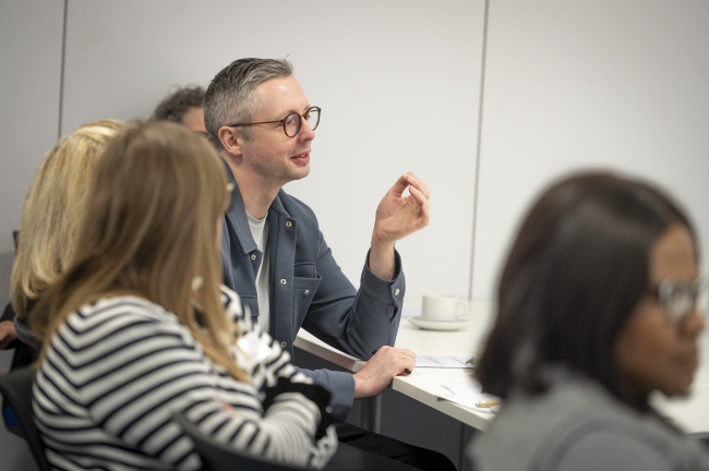 People chatting at a meeting